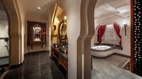 A heritage-style villa bathroom with arch detailing