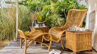 Tented Suite — rattan loungers with binoculars and tea tray on the deck at Bagh Villas, Kanha