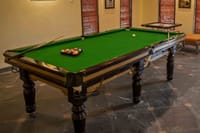 Games room with pool table and carrom board at WelcomHeritage Tadoba Vanya Villas, Tadoba