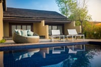 Inviting poolside oasis with lounge chairs