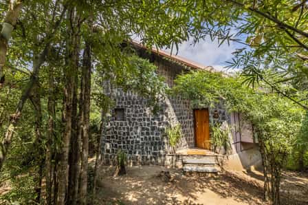 A stone cottage at Pench Tree Lodge