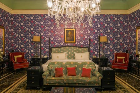 The Maharaja Suite bedroom under its chandelier