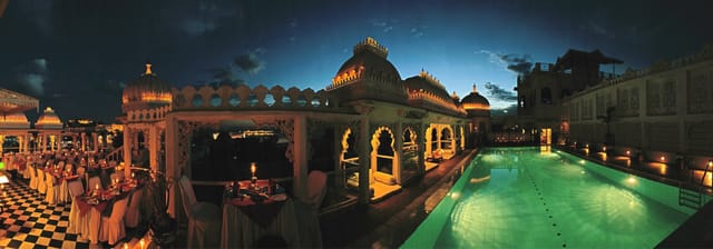 Udai Kothi rooftop pool at dusk, Udaipur