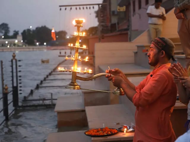 Aarti on the retreat's own ghat, and a room above the river.