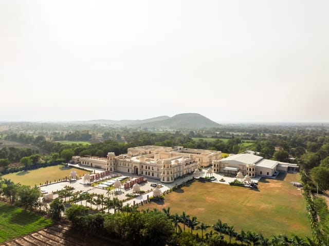 Aerial drone view of the palace-style resort and grounds by day, Kesar Bagh Palace, Chittorgarh