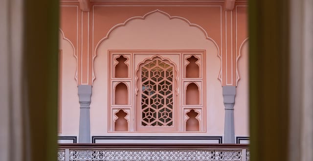 Rose-pink arches, niches and jaali screen of the haveli's courtyard facade, Padmaa, Jaipur