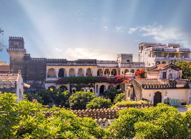 Crenellated rooftops, arched balconies and bougainvillea of the 17th-century retreat, Rawla Narlai, Narlai