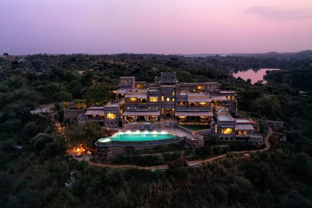 Drone view of Chunda Shikar Oudi amid woodland and lake