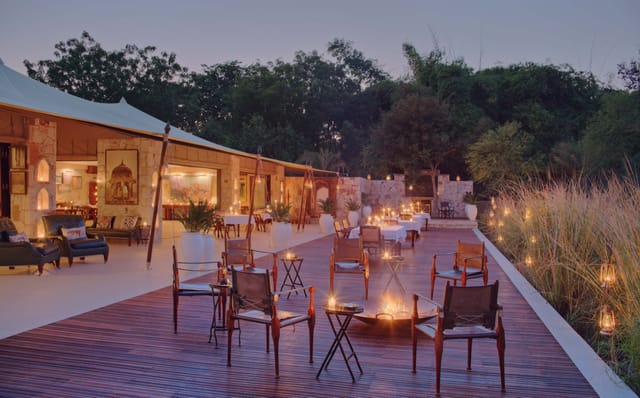 Sher Bagh's lantern-lit deck at dusk