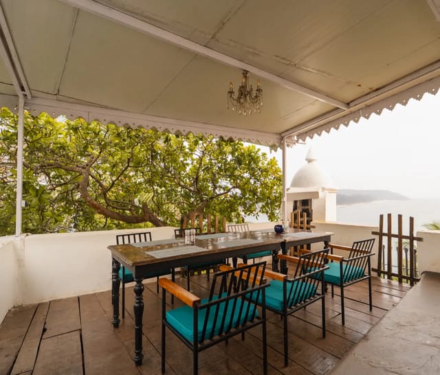 A terrace at Fort Tiracol looking past a whitewashed sentry turret to the sea and the Goan coast beyond
