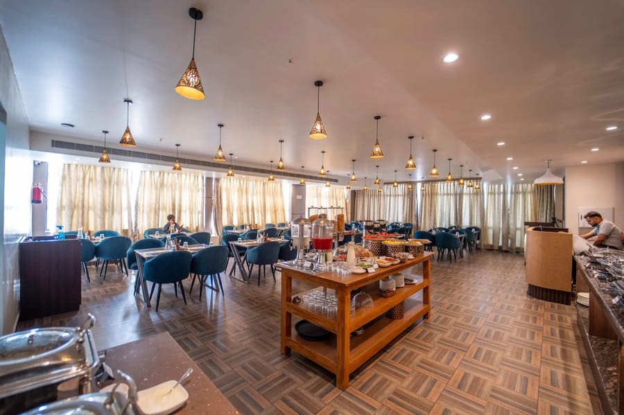 Dining area tables at Atithi Mangalam, Mosaic Connect Ayodhya, Ayodhya