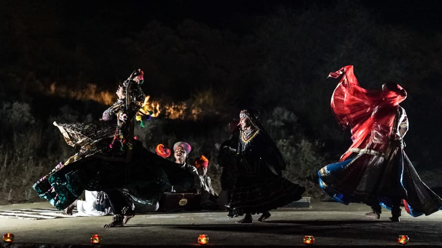 Rajasthani folk dancers performing by candlelight in the evening, Dhora Desert Resort & Spa, Shekhala