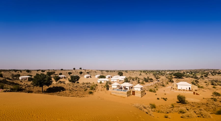White tented suites scattered across the sand dunes, Dhora Desert Resort & Spa, Shekhala