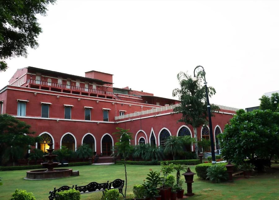 The red sandstone wing and its garden at the Maharaja Ganga Mahal
