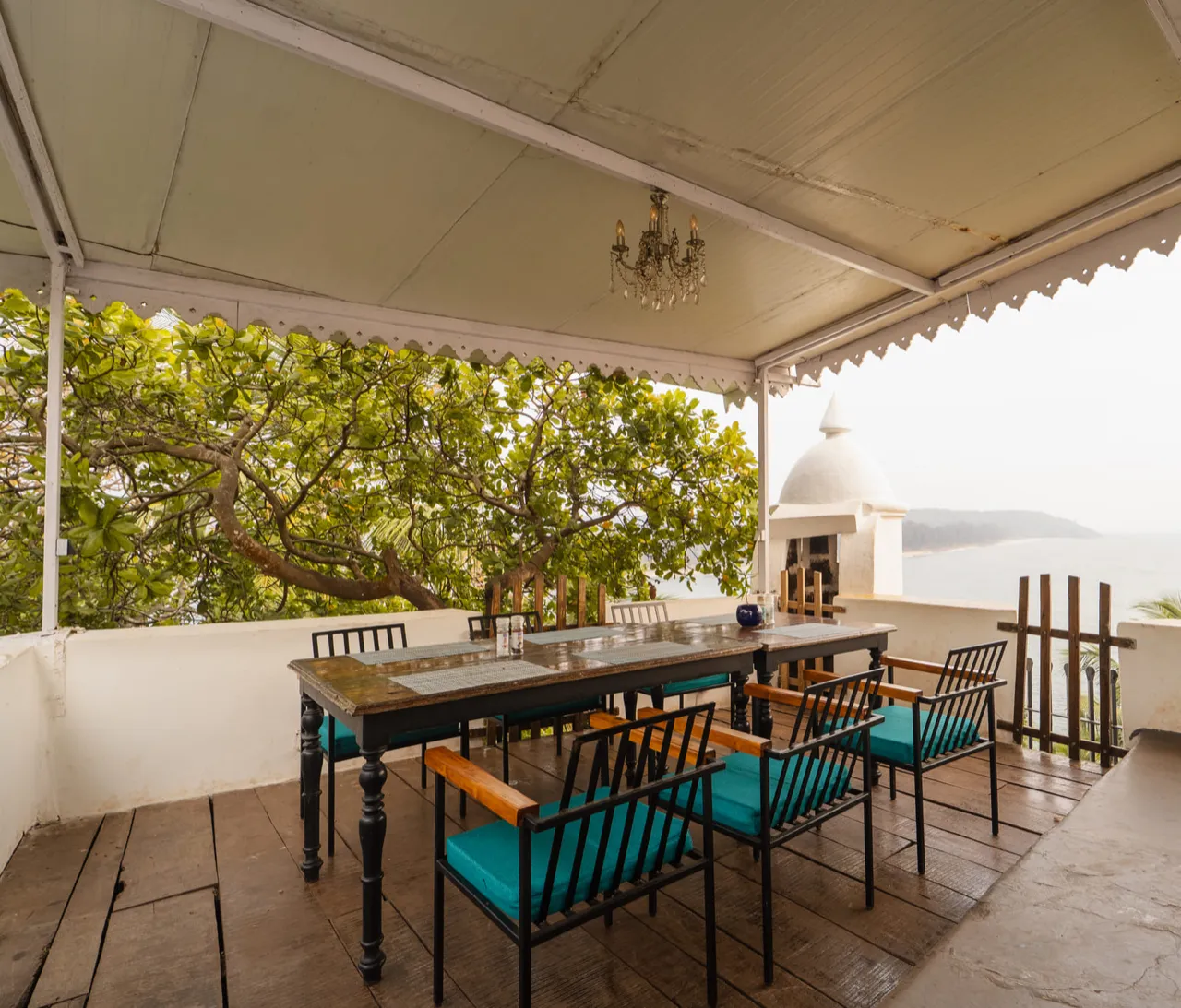 A terrace at Fort Tiracol looking past a whitewashed sentry turret to the sea and the Goan coast beyond